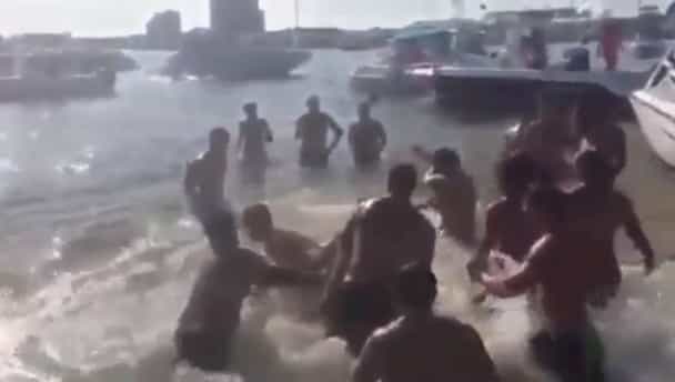 Video: Gentle seaside splashing erupts into massive Spring Break brawl