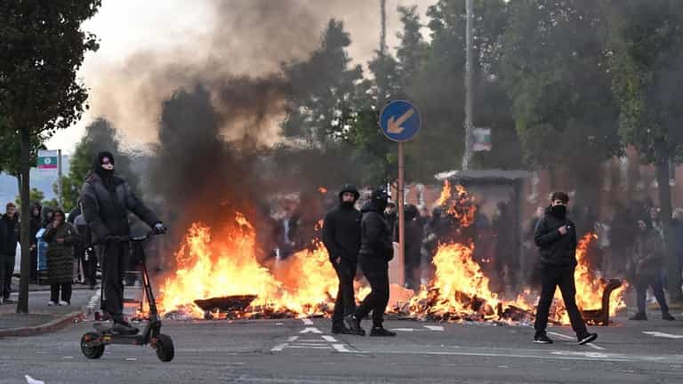 Homes and cars torched as violence erupts across Belfast after knife attack