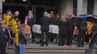 Coffins of Philip and Kim English and their sons arrive at Sacred Heart Church for the Waterford arson funeral