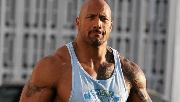 The Rock shows off the new WWE title belt