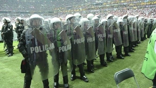 Riot police join in with the fans in Argentina