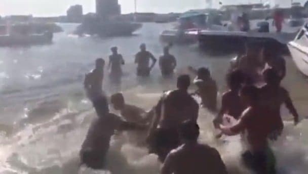 Video: Gentle seaside splashing erupts into massive Spring Break brawl