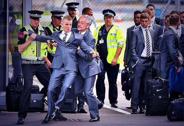 Pic of the day: Tom Cleverley* led away after trying to board England flight to Miami