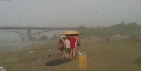 Video: Siberian sunbathers flee from golf balls sized hailstones