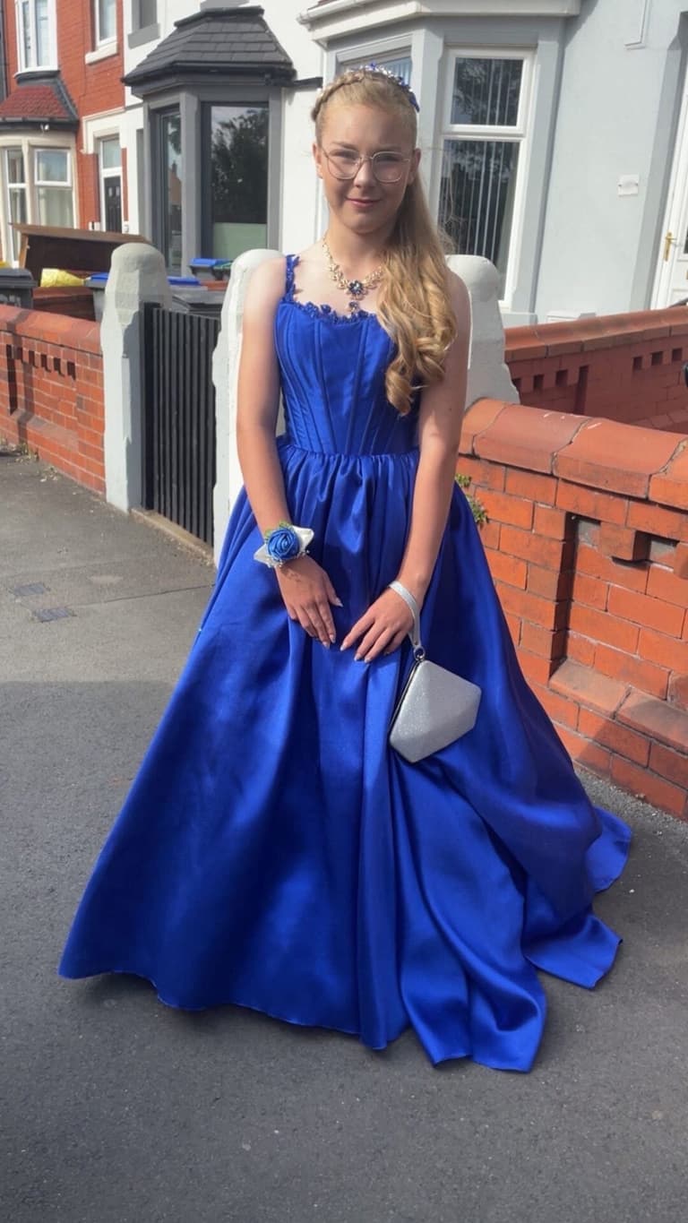 Schoolgirl left in tears after bullies ‘tear her prom dress to pieces’