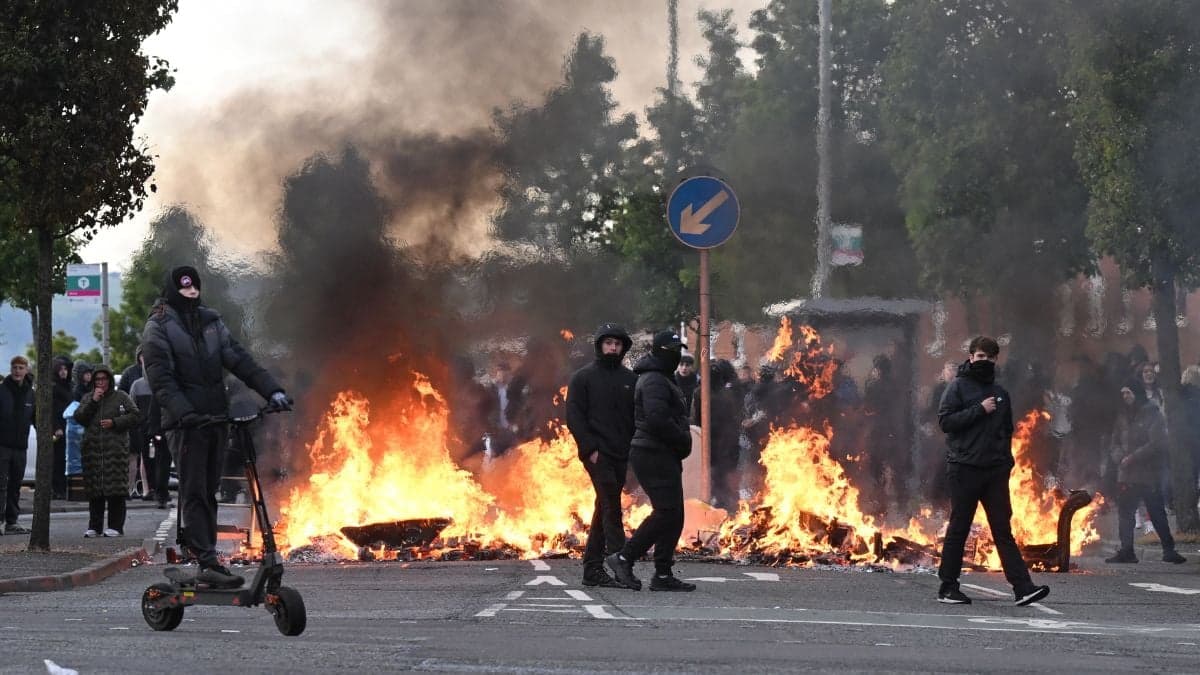 Homes and cars torched as violence erupts across Belfast after knife attack