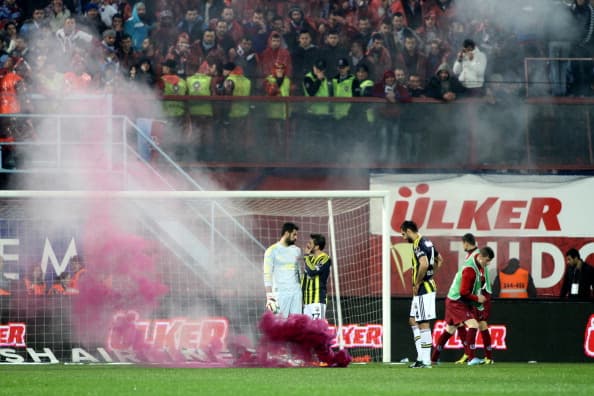 Video: Match abandoned in Turkey as fans throw bricks and flares at players Video: Match abandoned in Turkey as fans throw bricks and flares at players