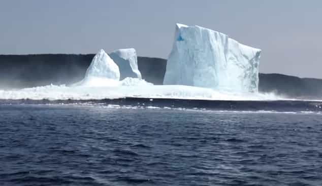 Video: Iceberg collapses causing huge tidal wave to rush towards terrified onlookers Video: Iceberg collapses causing huge tidal wave to rush towards terrified onlookers
