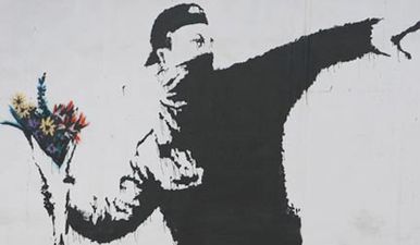 Elusive artist Banksy revealed his identity to a kind schoolboy that helped him