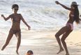 Pics: Rihanna showcases her football and beering skills at the same time