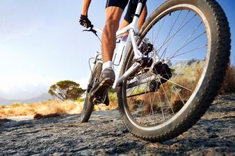 Video: Cyclist gets the mother of all cramps during interview