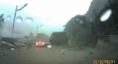 Video: Incredible footage from Taiwan as motorist escapes death from boulder by millimetres