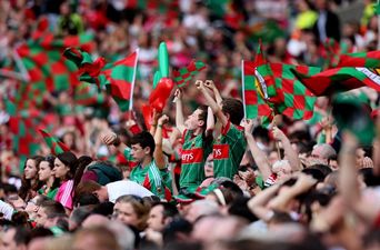 Pic: Spot the lad in the Mayo jersey (and the giant green afro wig) in the middle of J-Lo’s World Cup music video