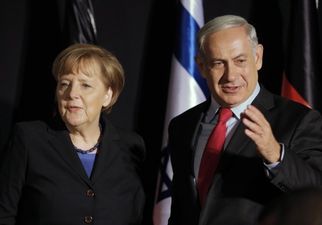 PIC: Benjamin Netanyahu accidentally gave Angela Merkel a Hitler moustache today