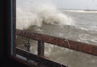Video: Californian diners get drenched after wave crashes through window