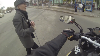 Video: Good guy biker stops traffic for elderly pedestrian