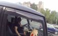 Video: Russian leather-clad vigilante punishes litter bugs by dumping rubbish all over them