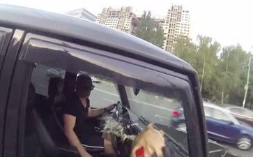 Video: Russian leather-clad vigilante punishes litter bugs by dumping rubbish all over them