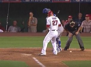 Vine: Ouch, an umpire gets hit with a baseball right in the nuts while Homer Simpson laughs