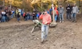 Video: Motocross spectator jumps over rider while taking a phone call