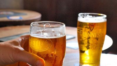 PIC: Two Cork lads calmly drink their pints as Storm Frank floods the bar they’re in