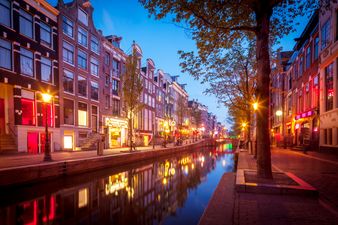 PIC: Just a distracted Irishman visiting Amsterdam’s red light district with his girlfriend