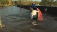 VIDEO: Tánaiste Joan Burton falling out of a boat in Kilkenny floods