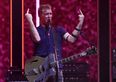 Queens Of The Stone Age frontman kicks female photographer in the head during California show