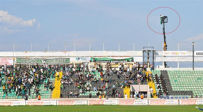 Football fan receives stadium ban, so he hired a crane to watch the game from