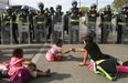 US Customs & Border Patrol use tear gas to stop asylum-seekers crossing the border