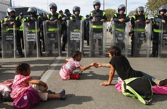 US Customs & Border Patrol use tear gas to stop asylum-seekers crossing the border