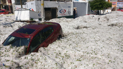 Freak hail shower in Mexico sees 1.5m of ice fall, burying cars and damaging houses
