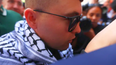 Kneecap rapper Mo Chara arrives at Court wearing a keffiyeh