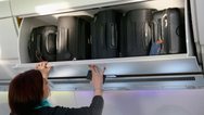 Plane passengers could be allowed to bring two bags free of charge under major law change